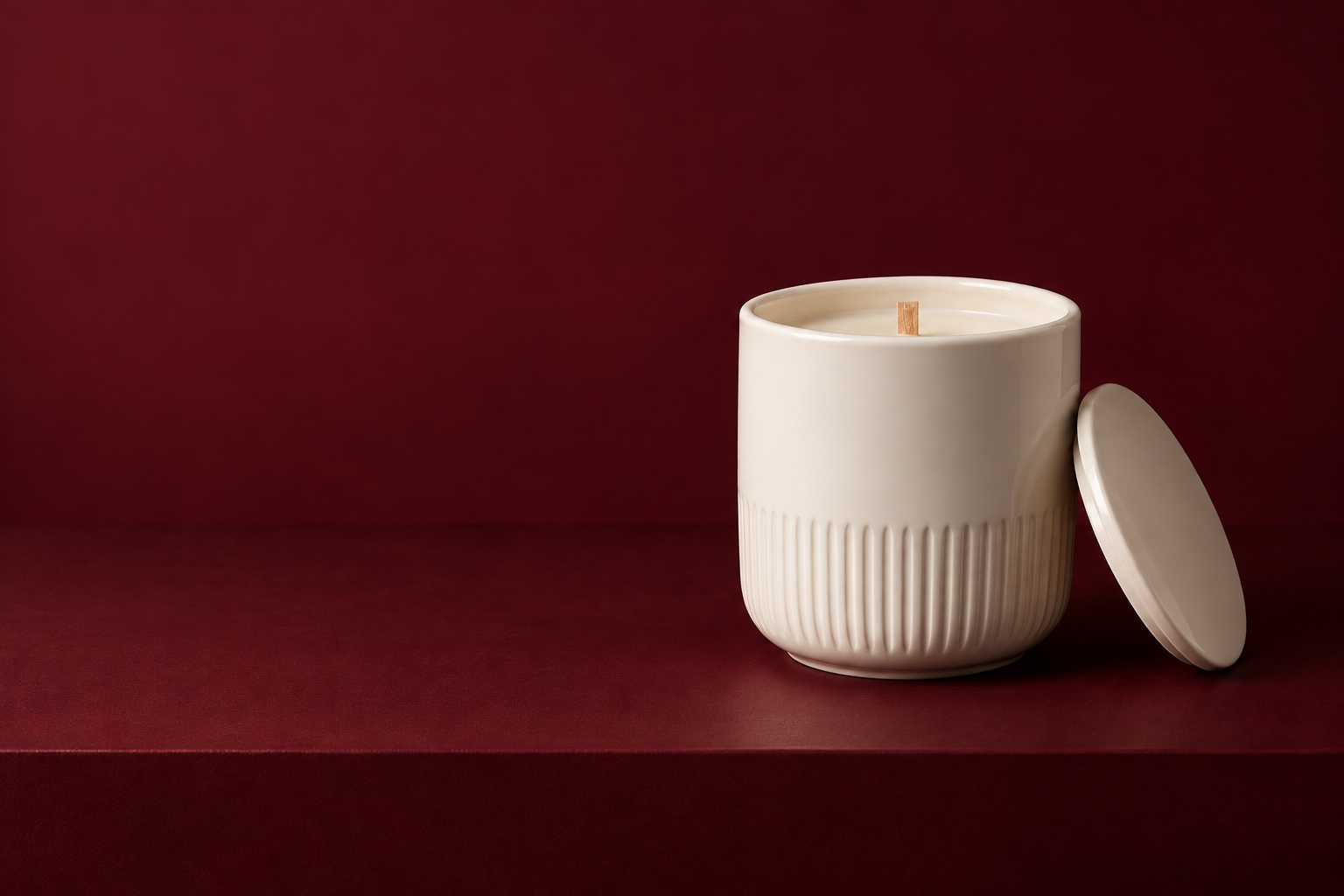 White Tea candle in a warm ivory porcelain vessel