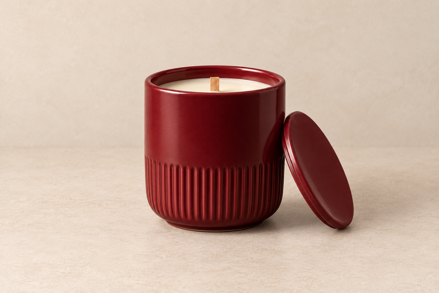Bergamot candle in an oxblood porcelain vessel